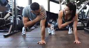 Toning Bingo Wings: Your Ultimate Guide to Sculpting Sleek Arms at the Gym 3 Fitness trainer demonstrating arm toning exercises Llanelli