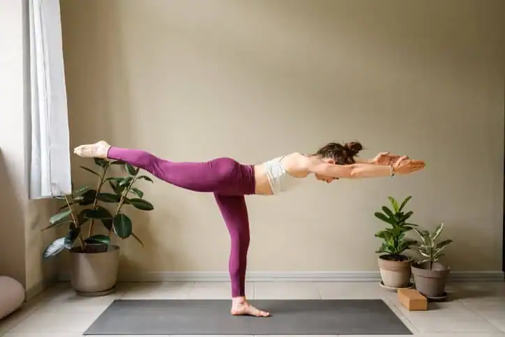 Woman doing Yoga exercise Llanelli to help with toning the body. 